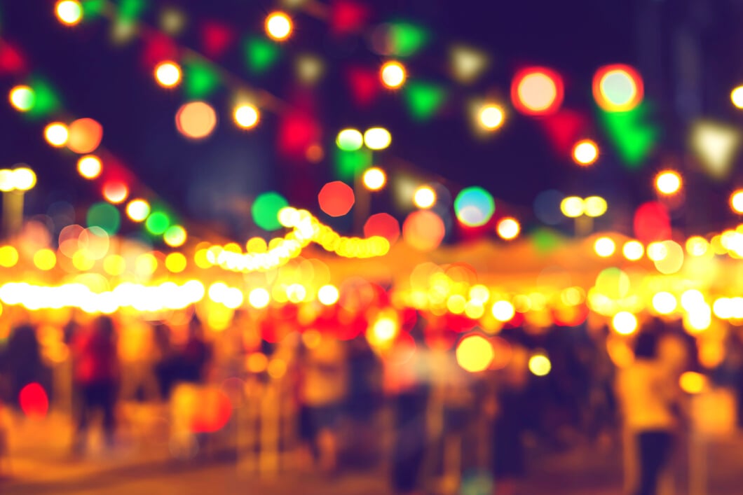 blur bokeh night festival warm light cool chill party in walking street.